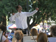 Ken Selden conducts the Vancouver Symphony Orchestra as it performs a concert of light classical music in Esther Short Park in 2018. The orchestra and the city of Vancouver are collaborating on the inaugural Vancouver USA Arts and Music Festival Aug. 4-6 in and around Esther Short Park.