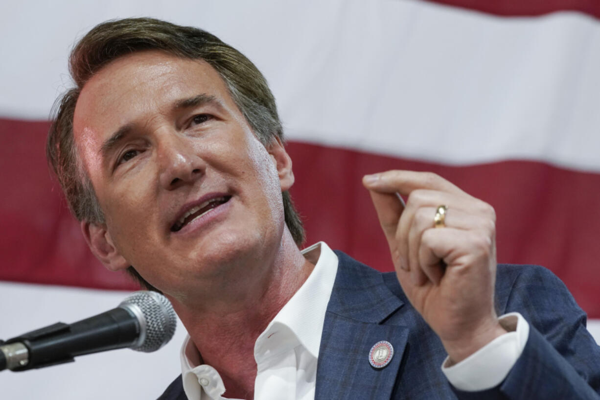 FILE - Virginia Gov. Glenn Youngkin speaks prior to signing the budget at a ceremony at a grocery store June 21, 2022, in Richmond, Va.  Youngkin is set to issue a third round of endorsements in Virginia legislative races, backing 19 more Republican candidates, including six who are in contested primaries.