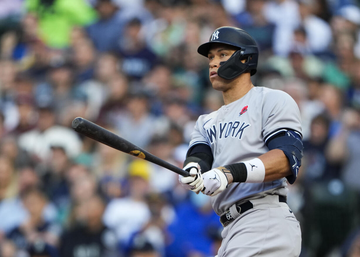 New York Yankees' Aaron Judge watches his two-run home run against the Seattle Mariners during the third inning of a baseball game Monday, May 29, 2023, in Seattle.