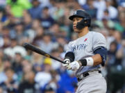 New York Yankees' Aaron Judge watches his two-run home run against the Seattle Mariners during the third inning of a baseball game Monday, May 29, 2023, in Seattle.