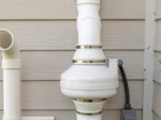 A radon mitigation system uses pipes and fans to redirect radon out of the home.