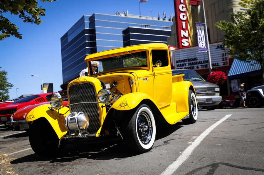 Pamela Lund peeks inside a 1931 Ford pickup during the Cruise the Couve event held on Main Street in Vancouver in 2019.