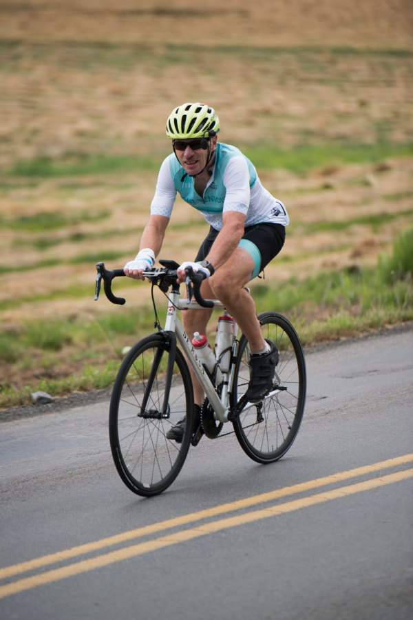 Tom Napier rides near the Clark County Fire & Rescue Station 24 in Ridgefield in 2019 while riding the 68-mile Bike Around Clark County loop. Bicyclists chose from 5 route lengths offered by Ride Around Clark County and organized by the Vancouver Bike Club.