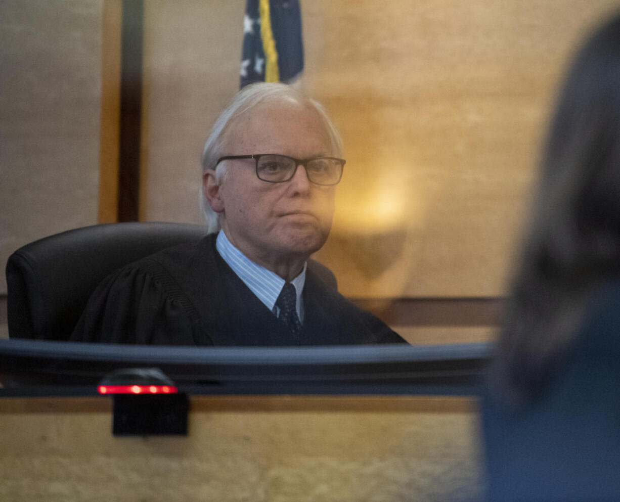 Clark County Superior Court Judge Robert Lewis listens to the prosecutions closing arguments Wednesday, Feb. 1, 2023, during the murder trial of suspected serial killer Warren Morris at the Clark County Courthouse. Forrest is charged with first-degree murder in the killing of 17-year-old Martha Morrison of Portland in 1974.