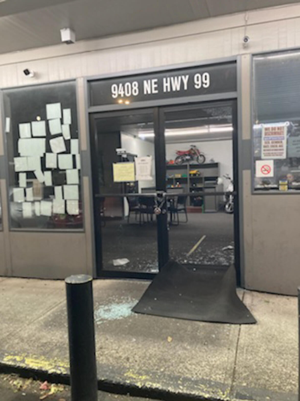 A shattered front door of a Hazel Dell car dealership after Clark County sheriff's deputies say a Vancouver man broke in and stole keys. The suspect was arrested on suspicion of second-degree burglary.