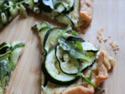 Topped with thin rounds of zucchini and creamy Boursin cheese, this summer tart takes just minutes to prepare.