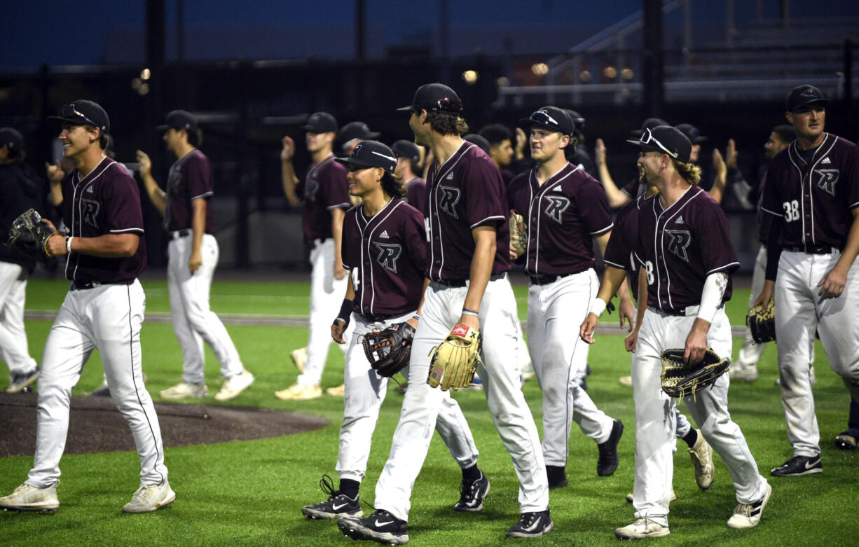 Ridgefield Raptors players exchange high fives after defeating the Edmonton Riverhawks, 4-3, to complete the series sweep on Thursday, June 8, 2023, at Ridgefield Outdoor Recreation Complex.