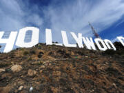 The freshly painted Hollywood sign is seen after a press conference to announce the completion of the famous landmark's major makeover in 2012, in Hollywood, Calif.