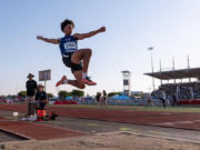 Ridgefield's Landon Kelsey leaps in the finals of the long jump at the WIAA 2A/3A/4A State Track and Field Championships on Thursday, May 25, 2023, at Mount Tahoma High School in Tacoma.