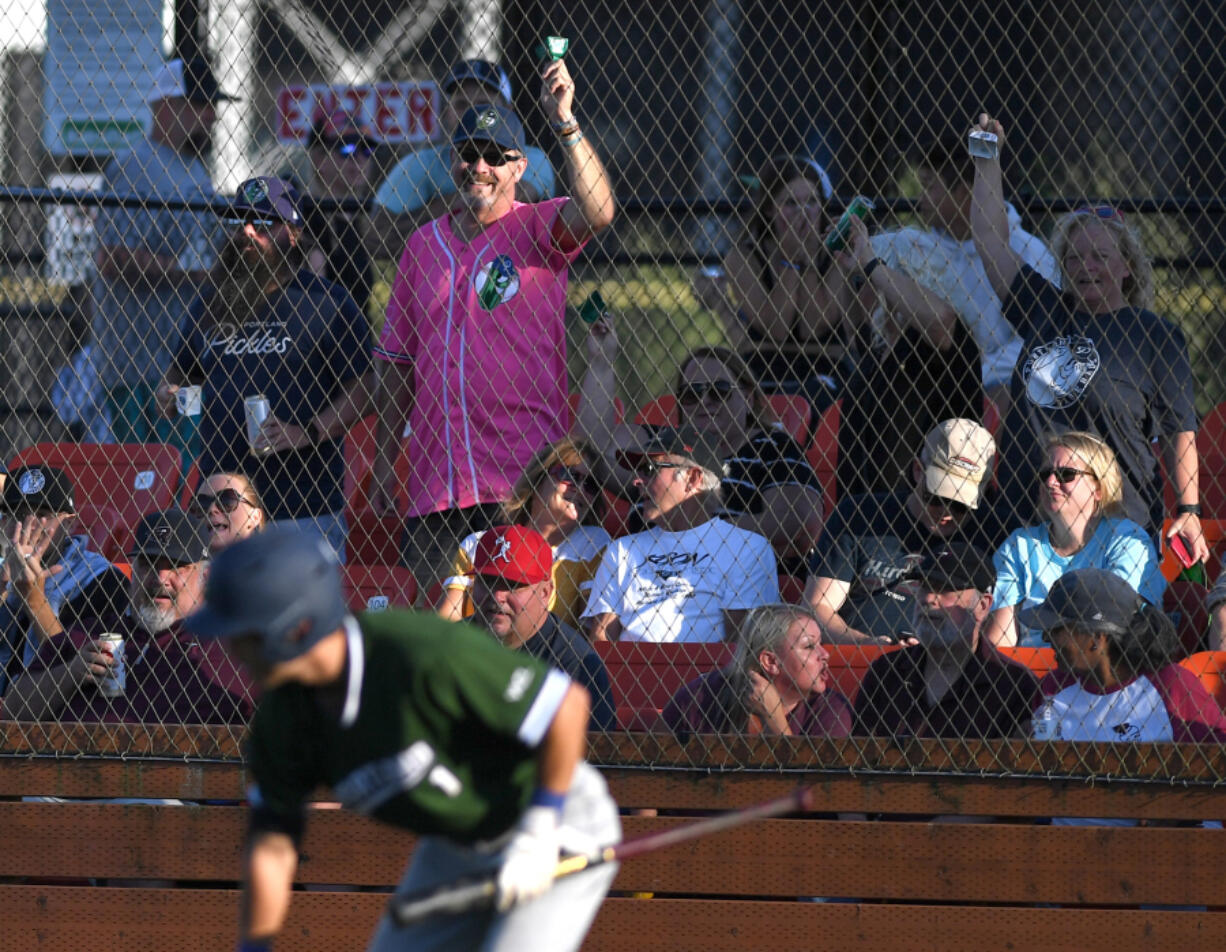 Portland Pickles fans celebrate a run Tuesday, Aug. 9, 2022, during a playoff game between the Ridgefield Raptors and the Portland Pickles at the Ridgefield Outdoor Recreation Complex.