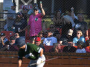 Portland Pickles fans celebrate a run Tuesday, Aug. 9, 2022, during a playoff game between the Ridgefield Raptors and the Portland Pickles at the Ridgefield Outdoor Recreation Complex.