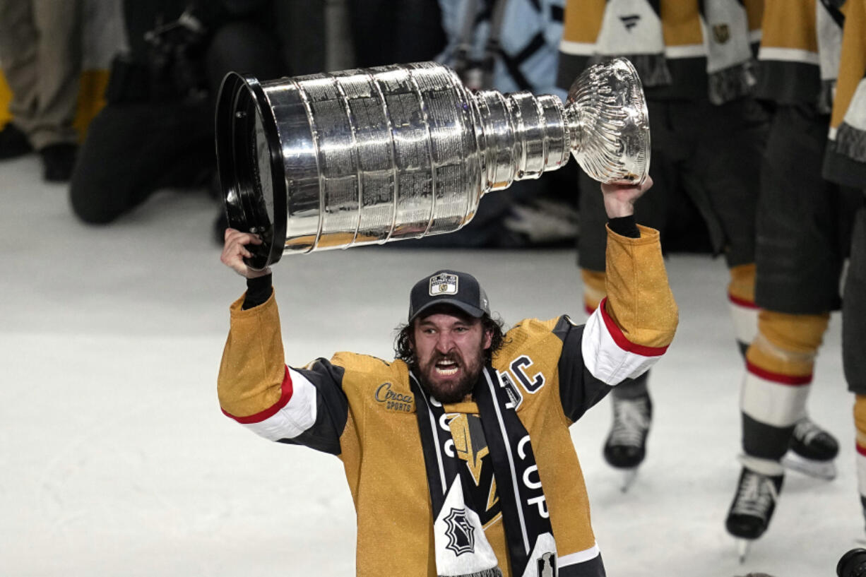 Vegas Golden Knights right wing Mark Stone skates with the Stanley Cup after the Knights defeated the Florida Panthers 9-3 in Game 5 of the NHL hockey Stanley Cup Finals Tuesday, June 13, 2023, in Las Vegas. The Knights won the series 4-1.