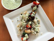 Grilled steak kebabs with spicy cilantro sauce is an easy summer dinner.