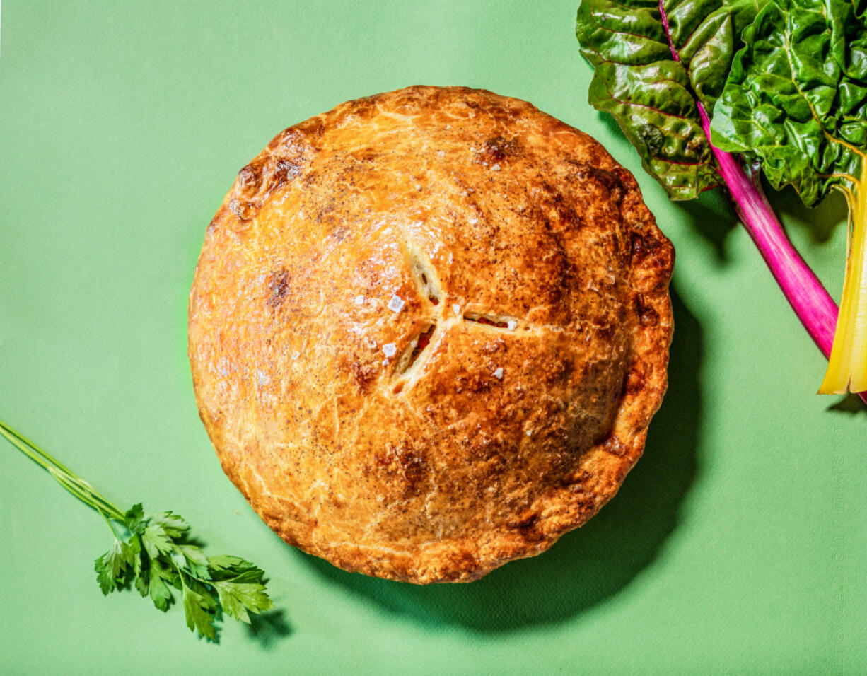 Chicken pot pie that brightens your day -- filled with bright vegetables and herbs.