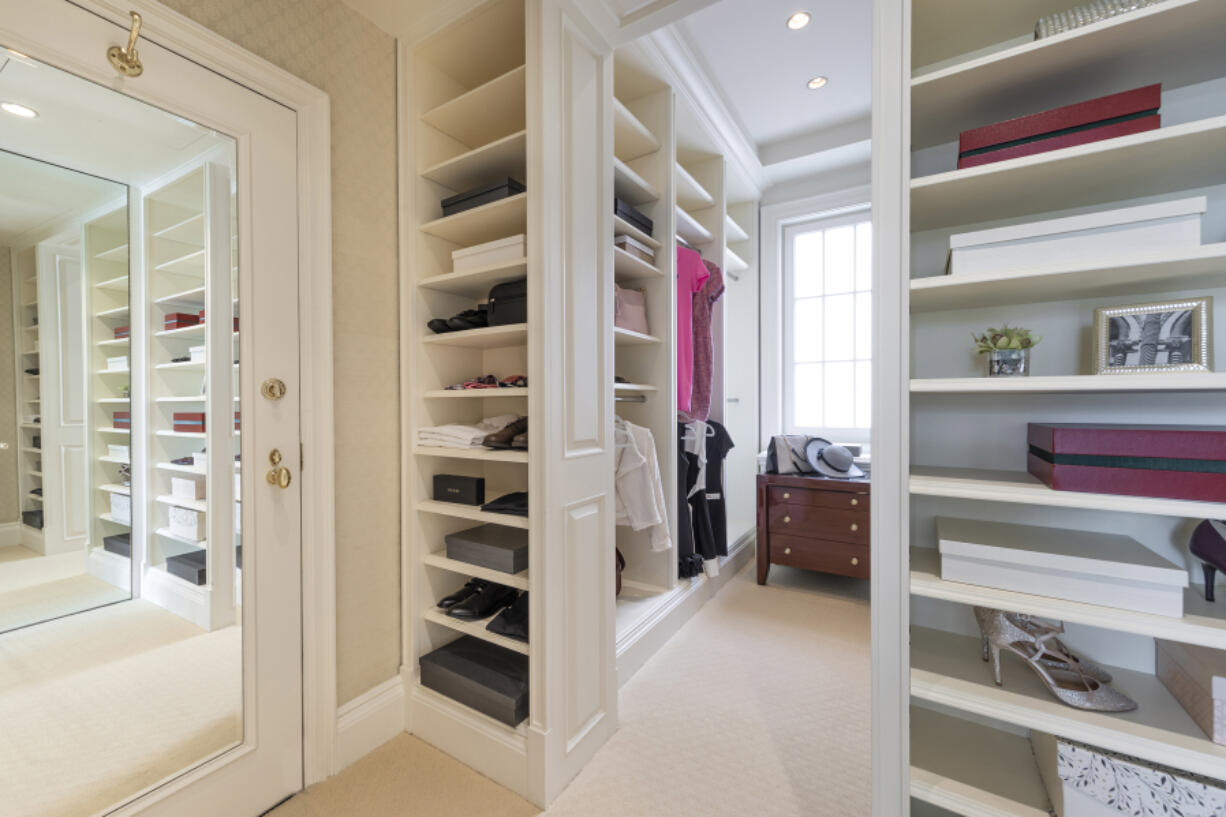 A large closet is converted into a closet and dressing area.