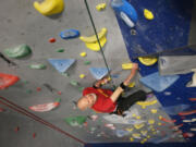 John Mowat, 94, climbs a route at the Bend Rock Gym in Bend, Ore.