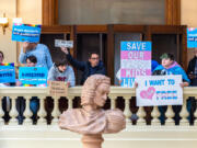 Opponents of SB 140, a bill that would prevent medical professionals from giving transgender children certain hormones or surgical treatment, gather in the Capitol in Atlanta on Monday, March 20, 2023.