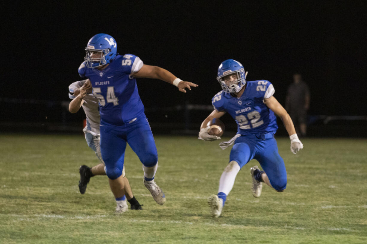 La Center's Levi Giles, right, earned Offensive MVP honors playing in the Earl Barden Classic, a statewide, small-school all-star football game, on Saturday in Yakima.