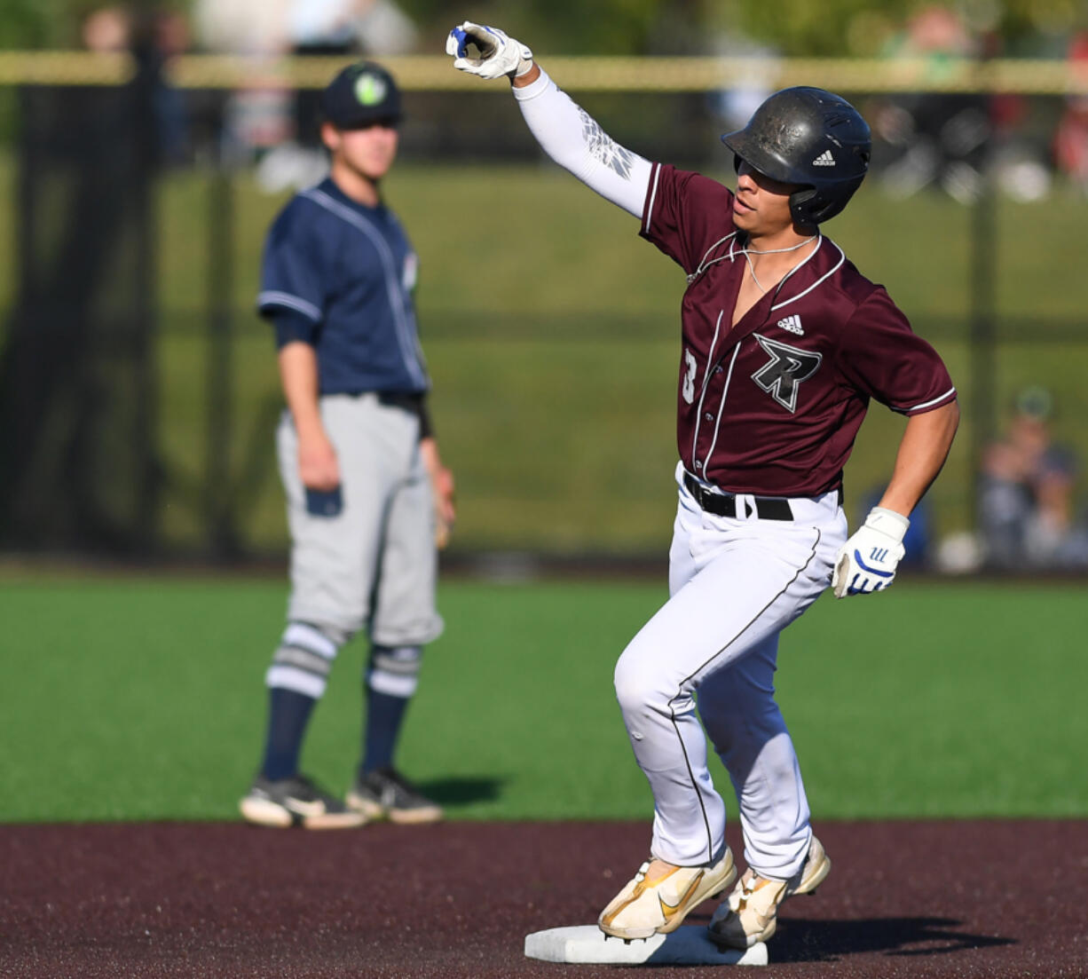 Ridgefield?s Jacob Sharp points as he rounds second base after a home run during a June 2022 game in Ridgefield. Sharp, last season?s West Coast League co-MVP, returned to the Raptors ahead of last week?s six-game road trip.