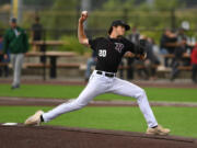 Ridgefield pitcher Dylan Stewart throws the ball Friday, June 16, 2023, during the Raptors' game against Cowlitz at the Ridgefield Outdoor Recreation Complex.