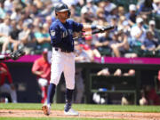 Seattle Mariners' AJ Pollock reacts to striking out against the Washington Nationals during the fifth inning of a baseball game Wednesday, June 28, 2023, in Seattle.