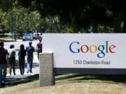 Google employees walk to and from the GooglePlex along Charleston Road in Mountain View, California, Tuesday, June 24, 2014.