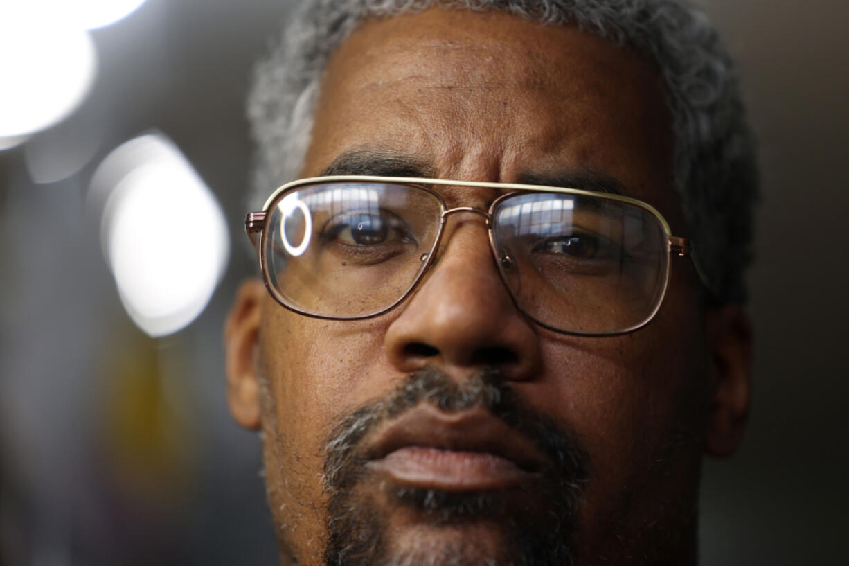 Yohance Lacour, shown in his Chicago studio, is the host of the podcast "You Didn't See Nothin," about the 1997 hate crime beating of 13-year-old Lenard Clark in the Bridgeport neighborhood of Chicago. (John J.