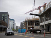 Construction continues on a new office building for ZoomInfo along the Vancouver waterfront near Columbia Way. Unlike Portland, demand for office space has been steady in Vancouver.