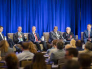 Attendees listen to a panel of transportation experts talk about the Interstate Bridge Replacement Project on Thursday during an Economic Forecast Breakfast event at Hilton Vancouver Downtown. Pictured from left to right: The Columbian transportation reporter and panel moderator William Seekamp, Vancouver City anager Eric Holmes, Thompson Metal Fab President John Rudi, Interstate Bridge Replacement Program Administrator Greg Johnson, Washington Trucking Associations President Sheri Call and Port of Vancouver Director of Economic Development Mike Bomar.