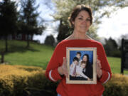 Vicki Bickford has always been a caregiver; soon she will need one of her own as her arthritis progresses. Bickford holds a photo of herself and her three children. WA Cares would help cover those costs.