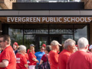 Evergreen Education Association members and allies stand outside the Evergreen Public Schools headquarters on June 14 in advance of a school board meeting. The union and the district are now entering mediation.