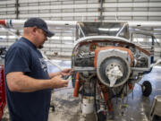 Director of maintenance Jason Cochran works on the front of an airplane at Pearson Field. Clark County's regional airports directly contribute millions of dollars in business revenues to the local economy, according to a study from the Washington State Department of Transportation.