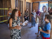 Architect Sharilyn Hidalgo, left, leads a tour through the Mullen-Polk Foundation's new facility, Our Next Generation II, on Thursday at the building's ground-breaking ceremony.