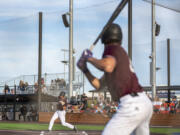Raptors designated hitter Andy Allanson, left, swings at a pitch Tuesday, June 27, 2023, during the Raptors’ game against Bend at the Ridgefield Outdoor Recreation Complex.