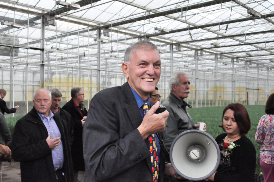 Benno Dobbe leads a crowd on a tour of one of his greenhouses at Holland America Flower Gardens in Woodland. Dobbe has donated money to fund a splashpad in Woodland.