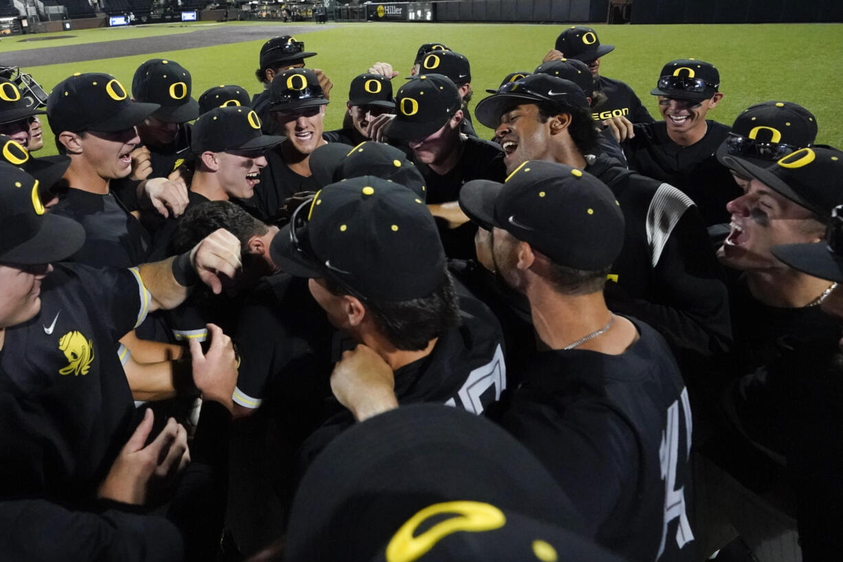 Oregon celebrates their 11-2 win against Xavier following an NCAA college baseball tournament regional championship game Sunday, June 4, 2023, in Nashville, Tenn.