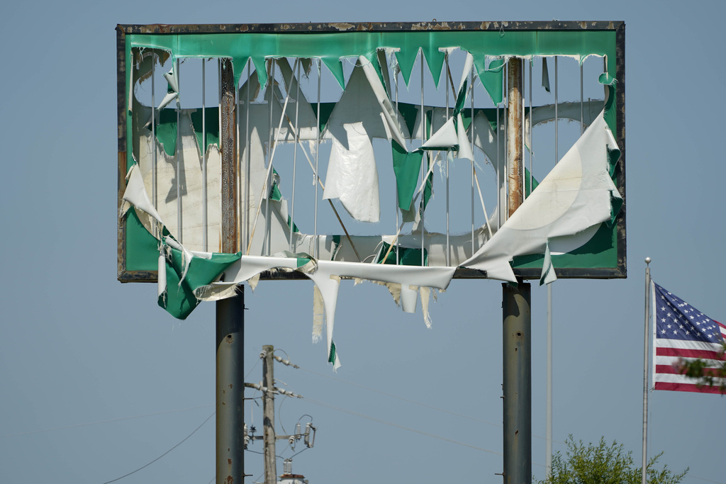 Severe weather that passed through Central Mississippi shredded this billboard in Ridgeland, Miss., Friday, June 16, 2023. A 67-year-old Canton man died after a tree fell on his home as a result of the inclement weather. (AP Photo/Rogelio V.