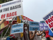 People protest outside of the Supreme Court in Washington, Thursday, June 29, 2023. The Supreme Court on Thursday struck down affirmative action in college admissions, declaring race cannot be a factor and forcing institutions of higher education to look for new ways to achieve diverse student bodies.