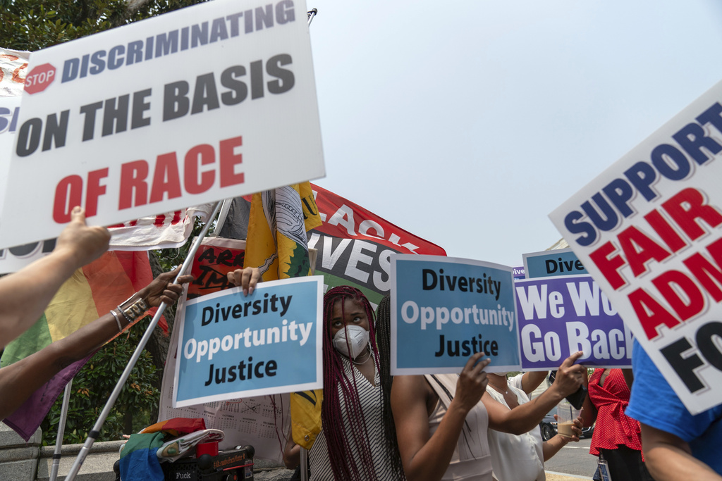 People protest outside of the Supreme Court in Washington, Thursday, June 29, 2023. The Supreme Court on Thursday struck down affirmative action in college admissions, declaring race cannot be a factor and forcing institutions of higher education to look for new ways to achieve diverse student bodies.