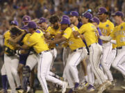 LSU celebrates after defeating Florida in Game 3 of the NCAA College World Series baseball finals in Omaha, Neb., Monday, June 26, 2023. LSU won the national championship 18-4. (AP Photo/Rebecca S.