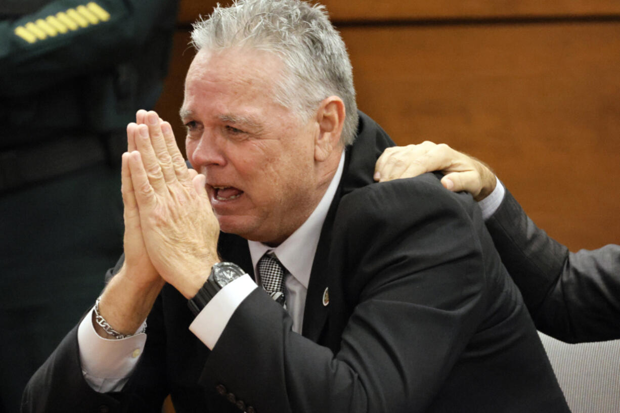 Former Marjory Stoneman Douglas High School School Resource Officer Scot Peterson reacts as he is found not guilty on all charges at the Broward County Courthouse in Fort Lauderdale, Fla., on Thursday, June 29, 2023. Peterson was acquitted of child neglect and other charges for failing to act during the Parkland school massacre, where 14 students and three staff members were murdered.