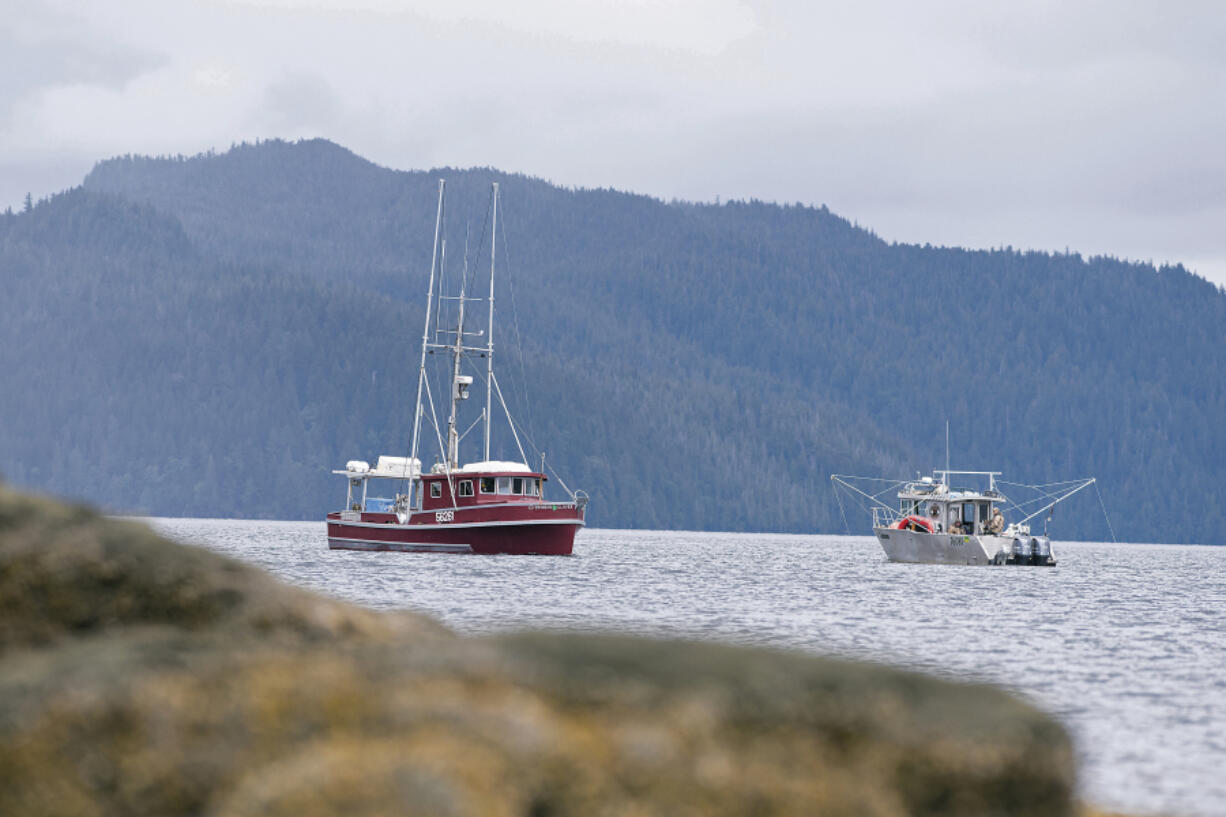 FILE - Two commercial troll fishing boats pass each other on June 2, 2020, at Mountain Point in Ketchikan, Alaska. A U.S. appeals court on Wednesday, June 21, 2023, halted a lower court ruling that would have shut down southeast Alaska's chinook salmon fishery for the summer to protect endangered orca whales that eat the fish.