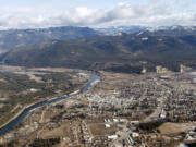 FILE - The town of Libby Mont., is shown Feb. 17, 2010. A major U.S. railroad found partially liable for asbestos contamination that's killed hundreds of people in a Montana town is trying to convince a federal jury a local clinic submitted hundreds of asbestos claims for people who weren't sick.