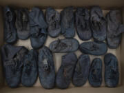 Shoes that belonged to child victims of the former Nazi German death camp Auschwitz-Birkenau lie in a box May 10 at the conservation laboratory on the grounds of the camp in Oswiecim, Poland.