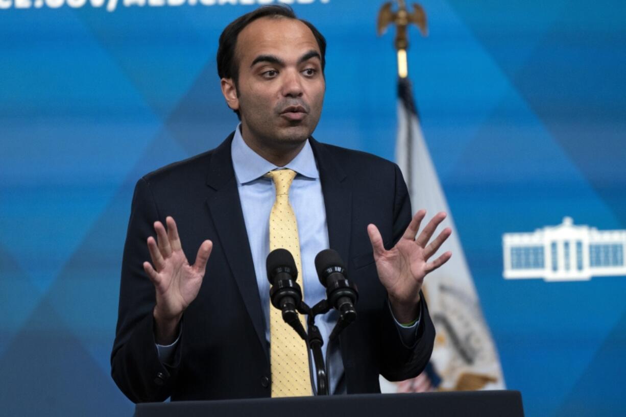 FILE - Consumer Financial Protection Bureau Director Rohit Chopra, speaks from the South Court Auditorium on the White House complex in Washington, April 11, 2022. The Consumer Financial Protection Bureau released a report Tuesday where the bureau lays out a number concerns about the growing use of chatbots by banks to handle routine customer service requests by customers.