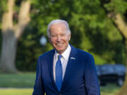 President Joe Biden smiles as he walks from Marine One upon arrival on the South Lawn of the White House, Thursday, June 1, 2023, in Washington. Biden is returning from Colorado.