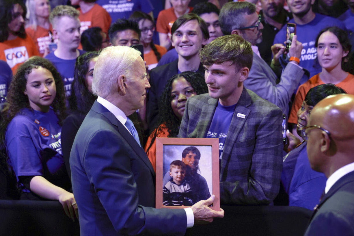 President Joe Biden speaks with people in the audience after delivering a speech at the National Safer Communities Summit at the University of Hartford in West Hartford, Conn., Friday, June 16, 2023. The summit is attended by gun safety advocates, local leaders and families impacted by gun violence.