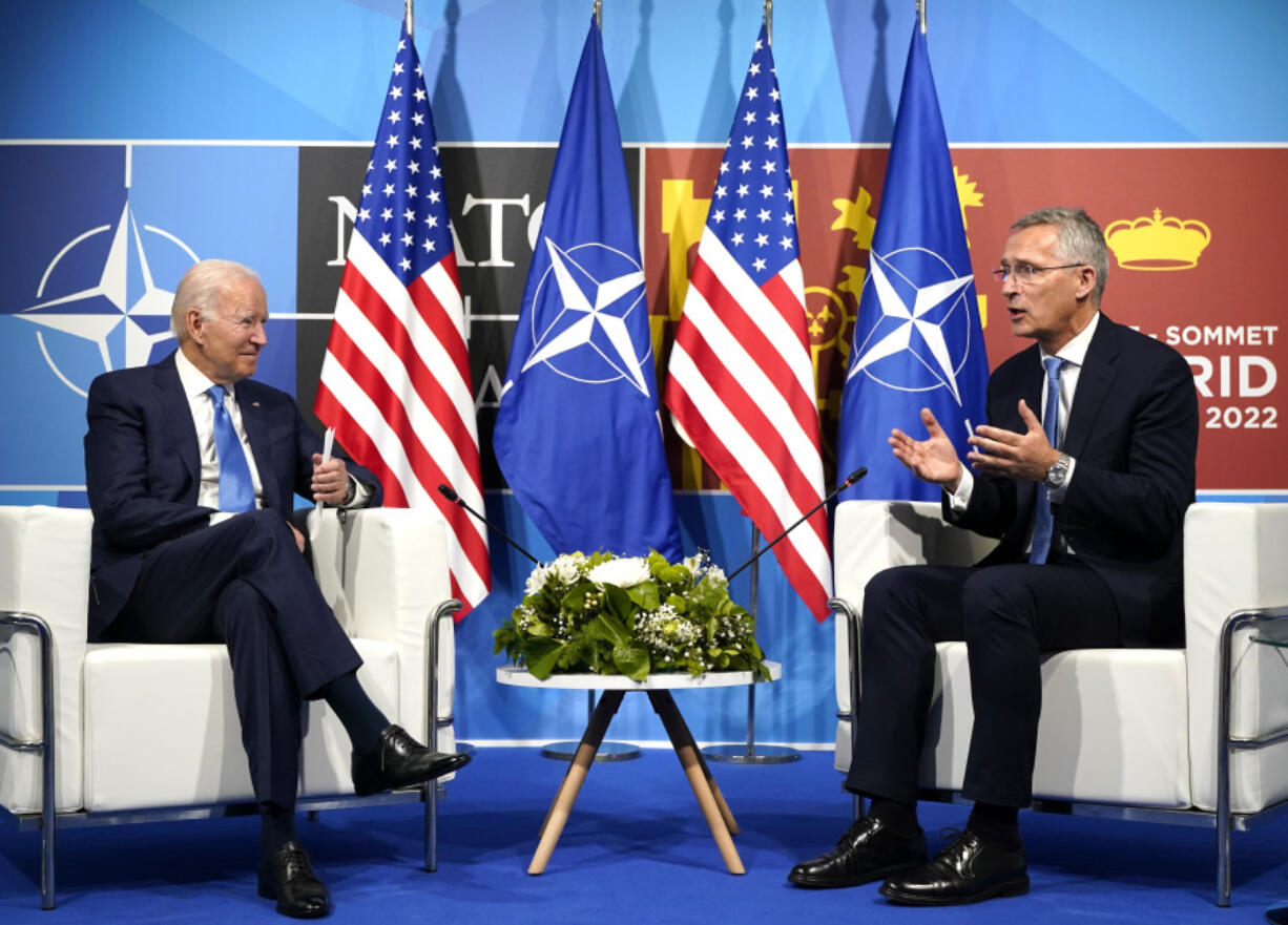 FILE - President Joe Biden, left, speaks with NATO Secretary General Jens Stoltenberg during a meeting at the NATO summit in Madrid, Spain on June 29, 2022. Biden is welcoming outgoing NATO Secretary-General Jens Stoltenberg to the White House on Monday, June 12, 2023, as the competition to find his successor to lead the military alliance heats up. Stoltenberg, who has led NATO since 2014 indicated earlier this year he would move on when his term expires at the end of September.