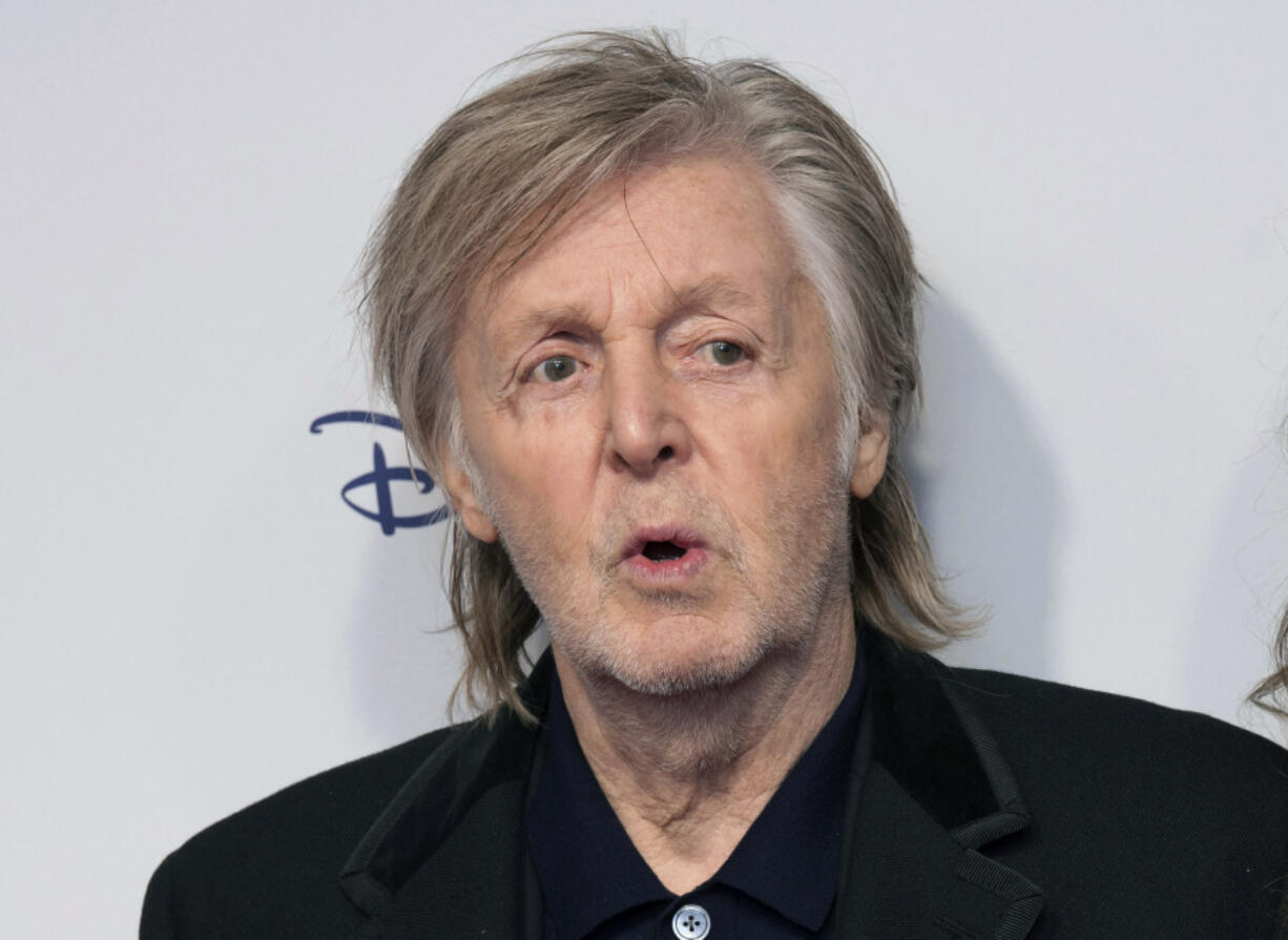 FILE - Paul McCartney and Nancy Shevell pose for photographers upon arrival for the premiere of the film 'If These Walls Could Sing' in London, Monday, Dec. 12, 2022. Artificial intelligence has been used to extract John Lennon's voice from an old demo to create "the last Beatles record," Paul McCartney said Tuesday, June 13, 2023.