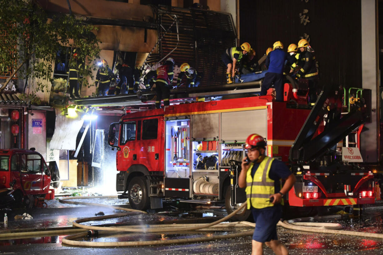 CORRECTS TO WEDNESDAY, NOT THURSDAY - In this photo released by Xinhua News Agency, firefighters work at the site of an explosion at a restaurant in Yinchuan, northwest China's Ningxia Hui Autonomous Region, Wednesday, June 21, 2023. A massive cooking gas explosion at a barbecue restaurant in northwestern China killed dozens and injured some, Chinese authorities said Thursday.